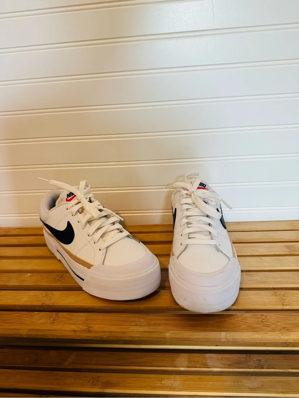 Nike White Low-Top Platform Sneakers with Black Swoosh